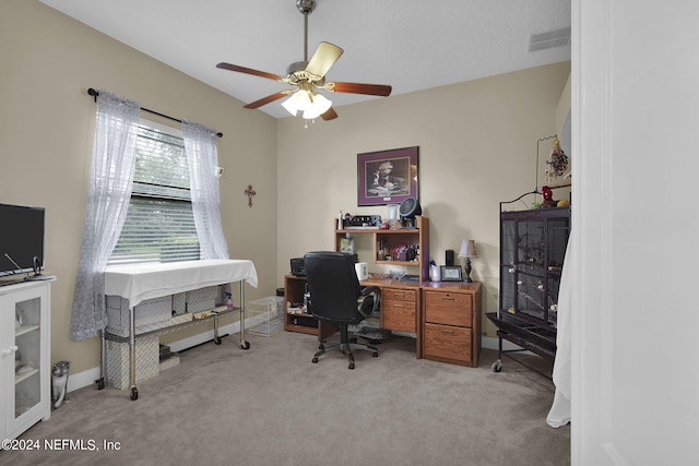 office space featuring ceiling fan and light colored carpet