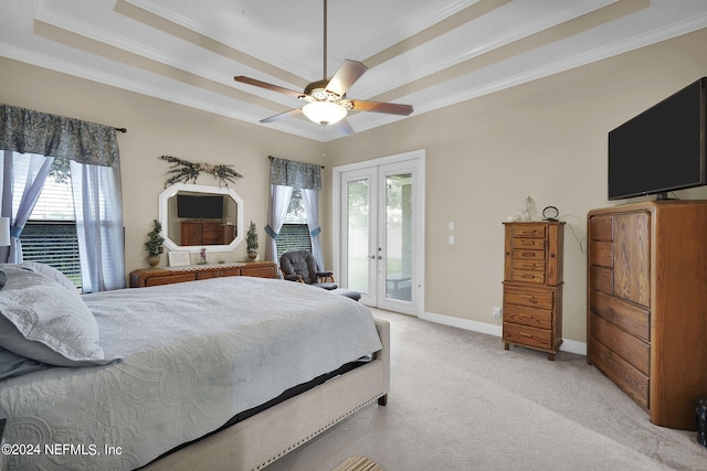 carpeted bedroom with french doors, ceiling fan, multiple windows, and access to outside