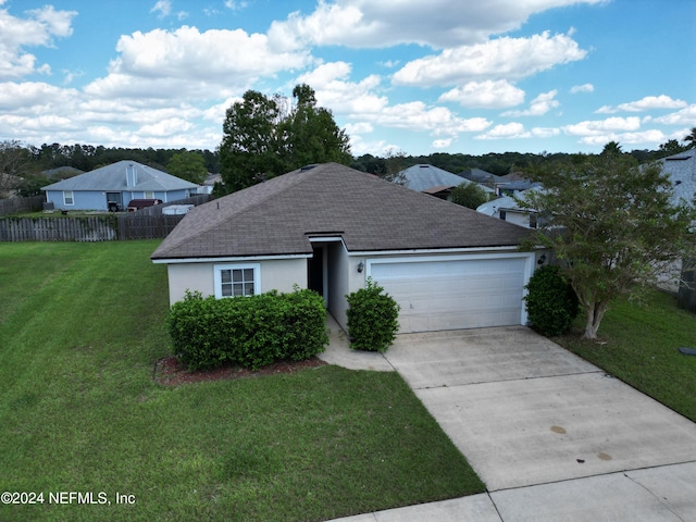 ranch-style house with a front lawn and a garage