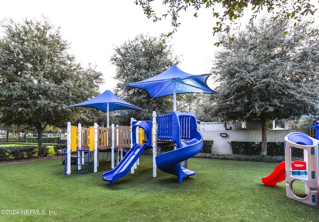 view of jungle gym featuring a yard