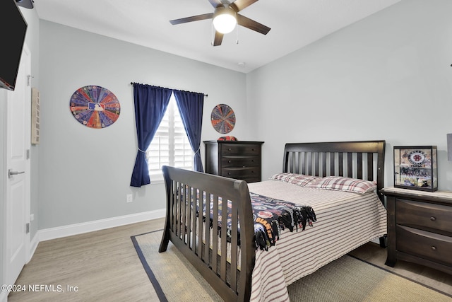 bedroom featuring light hardwood / wood-style floors and ceiling fan