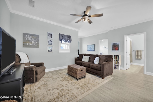 living room with ceiling fan, light wood-type flooring, and ornamental molding