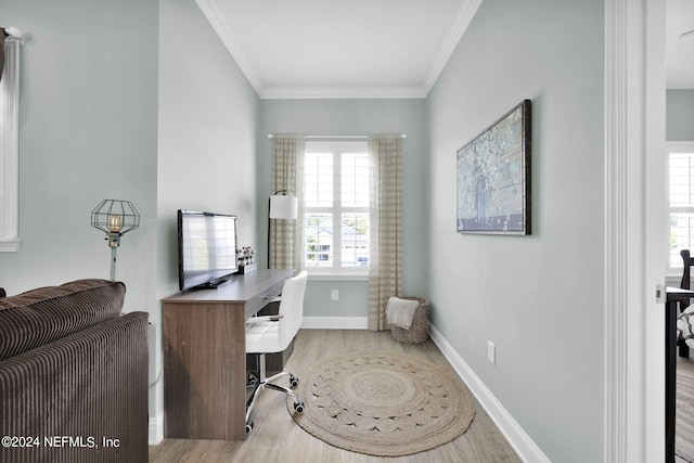 home office with wood-type flooring and crown molding