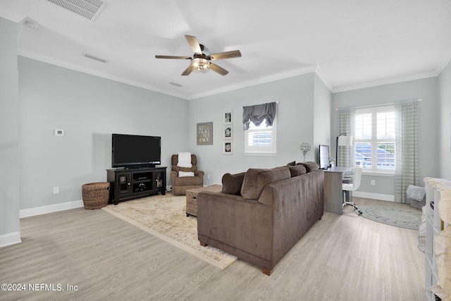 living room featuring light wood-type flooring, ceiling fan, and crown molding