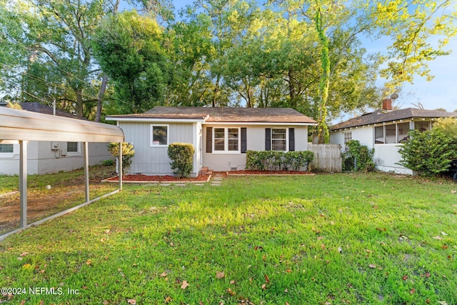 ranch-style home featuring a front yard