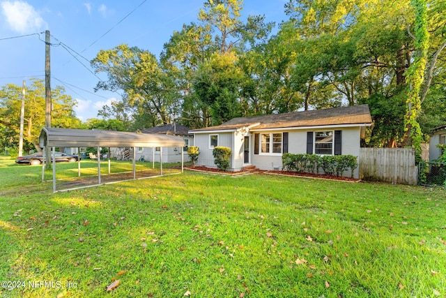 ranch-style house with a carport and a front yard