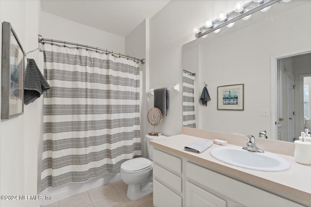 full bathroom featuring vanity, toilet, shower / bath combo, and tile patterned floors