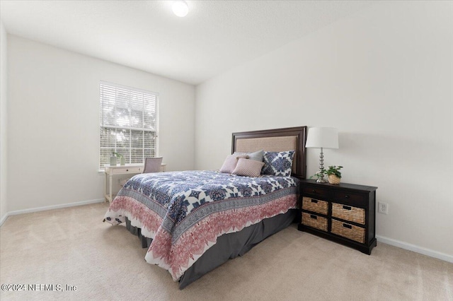 bedroom with light carpet