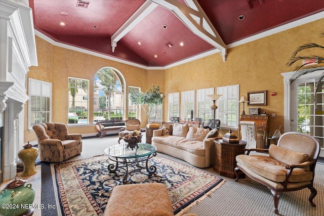 carpeted living room with beam ceiling and high vaulted ceiling