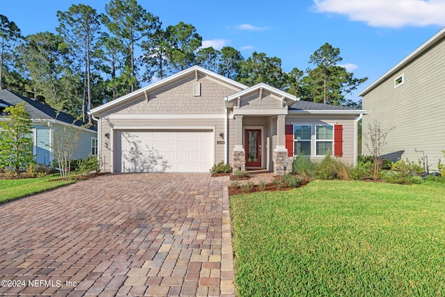 view of front facade with a garage and a front yard