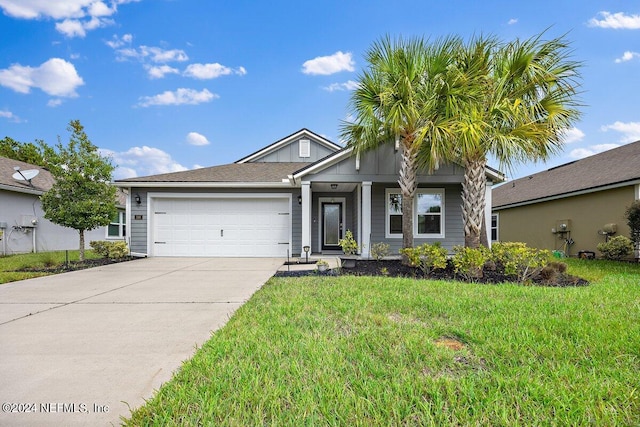 view of front of home featuring a garage and a front yard