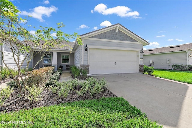 view of front facade with a garage and a front lawn