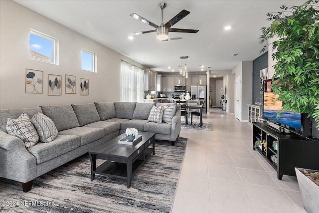 tiled living room with ceiling fan