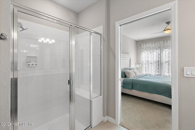 bathroom featuring ceiling fan and walk in shower