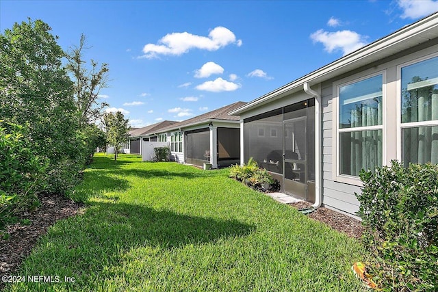 view of yard with a sunroom