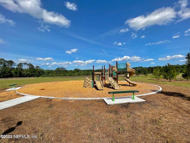 view of playground featuring a yard