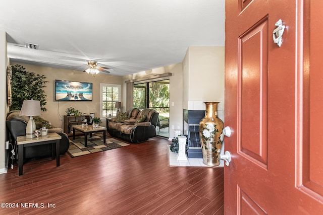 living room with hardwood / wood-style floors and ceiling fan