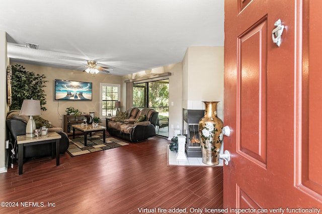 living room featuring ceiling fan and wood-type flooring