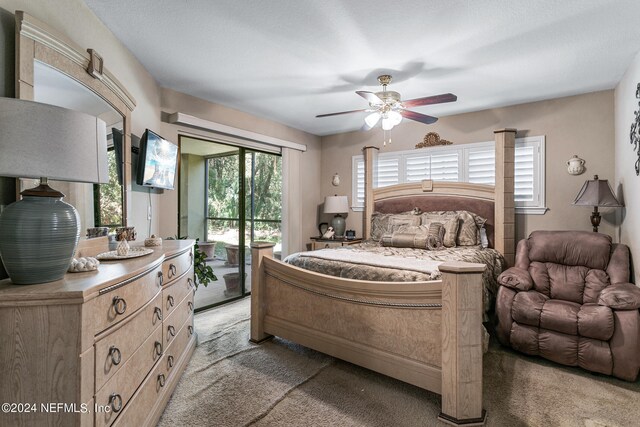 carpeted bedroom with access to exterior and ceiling fan