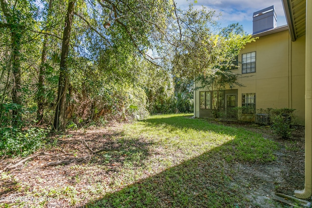 view of yard featuring central AC unit