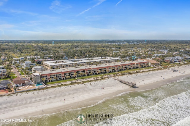 drone / aerial view with a water view and a view of the beach