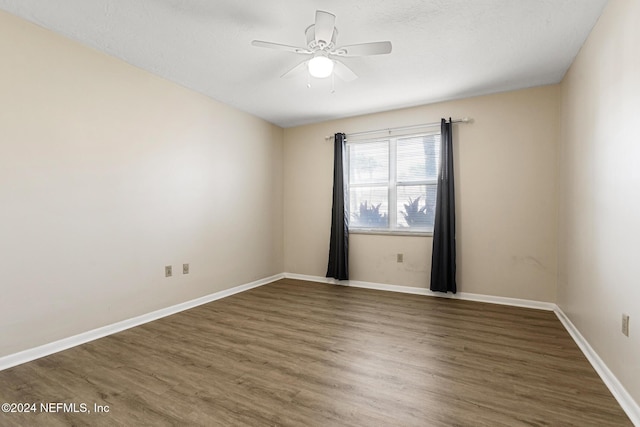 10 10th St Unit 37, Atlantic Beach, FL 32233 - unfurnished room featuring baseboards, wood finished floors, and ceiling fan