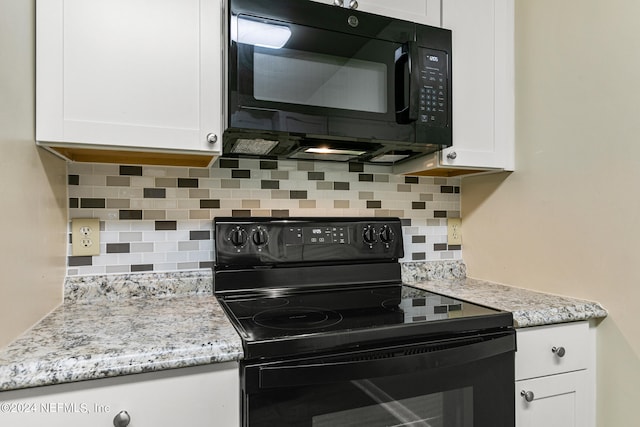 kitchen with decorative backsplash, white cabinetry, and black appliances