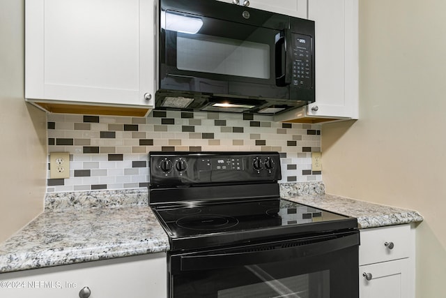 10 10th St Unit 37, Atlantic Beach, FL 32233 - kitchen featuring decorative backsplash, light stone counters, white cabinetry, and black appliances