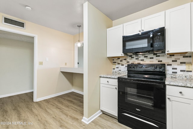 kitchen featuring black appliances, white cabinetry, and backsplash