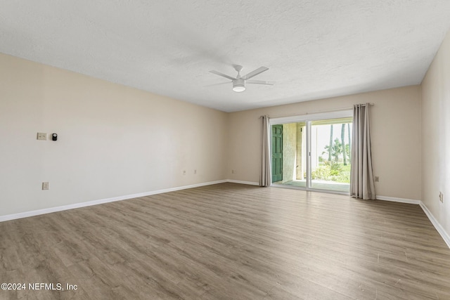 10 10th St Unit 37, Atlantic Beach, FL 32233 - spare room featuring ceiling fan, baseboards, wood finished floors, and a textured ceiling
