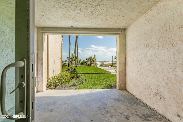 doorway to outside featuring concrete floors