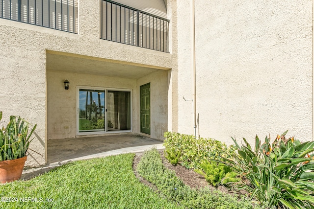 doorway to property with a patio