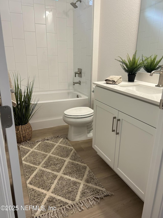 49 Pathway Ct, Saint Johns, FL 32259 - bathroom with toilet, wood finished floors, vanity, shower / tub combination, and a textured wall