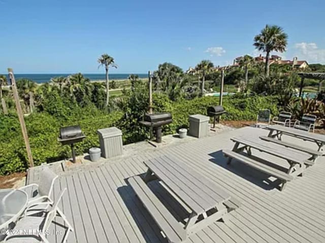 view of home's community featuring a deck with water view