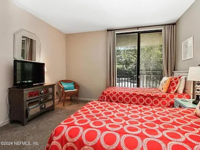 bedroom featuring access to exterior and carpet flooring