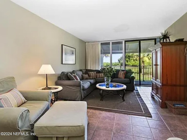 living room with floor to ceiling windows