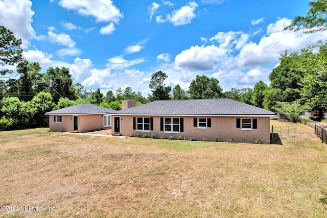 single story home with a front yard