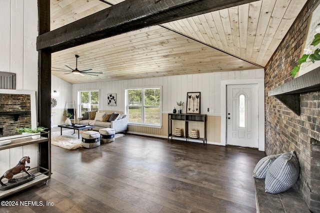 living room featuring wood ceiling, brick wall, wooden walls, dark wood-type flooring, and high vaulted ceiling