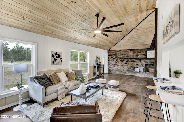 living room featuring lofted ceiling, a healthy amount of sunlight, wood ceiling, and hardwood / wood-style floors