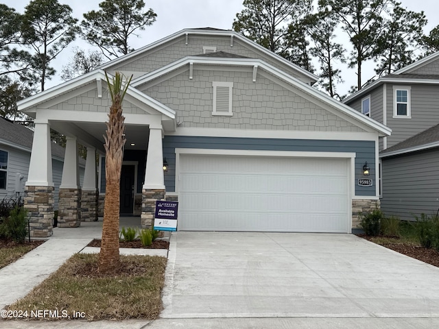 craftsman inspired home with a garage