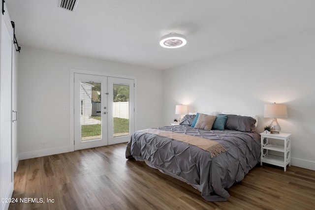 bedroom featuring hardwood / wood-style floors, french doors, and access to outside