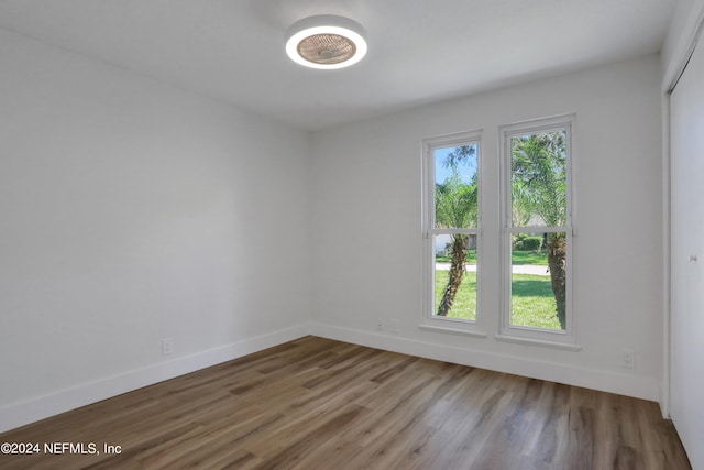 unfurnished room featuring wood-type flooring