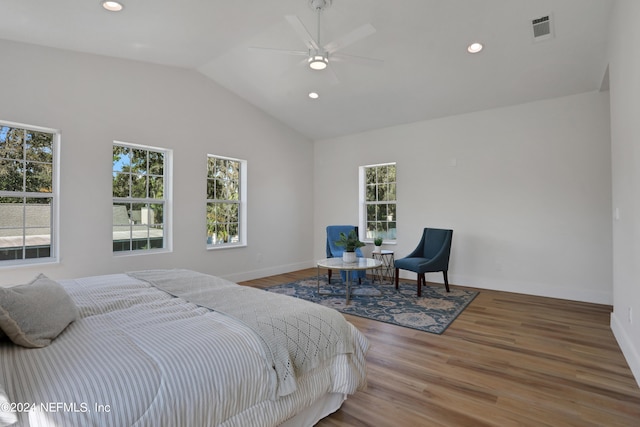 bedroom with hardwood / wood-style flooring, ceiling fan, and lofted ceiling