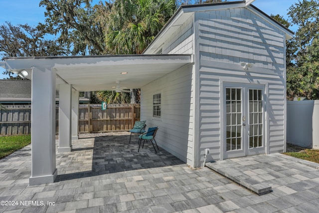 view of patio / terrace featuring ceiling fan and french doors