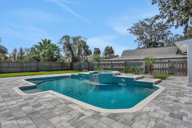 view of pool featuring an in ground hot tub and a patio area