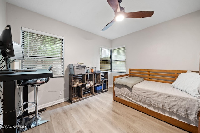 bedroom featuring hardwood / wood-style flooring and ceiling fan