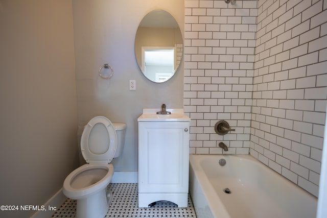 full bathroom featuring tile patterned floors, tiled shower / bath combo, vanity, and toilet