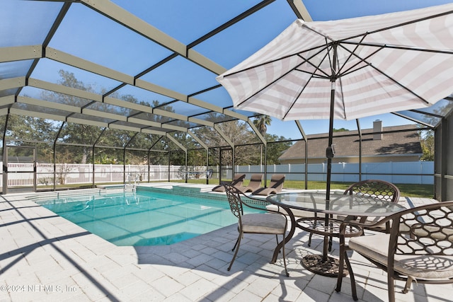 view of pool featuring a lanai and a patio area