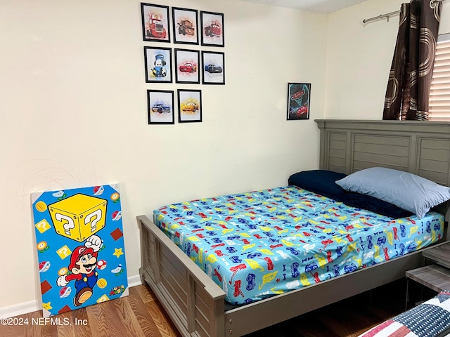 bedroom featuring hardwood / wood-style floors