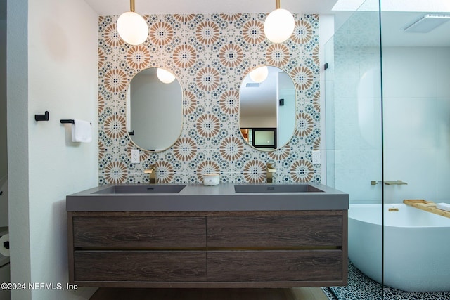 bathroom with a tub to relax in and vanity